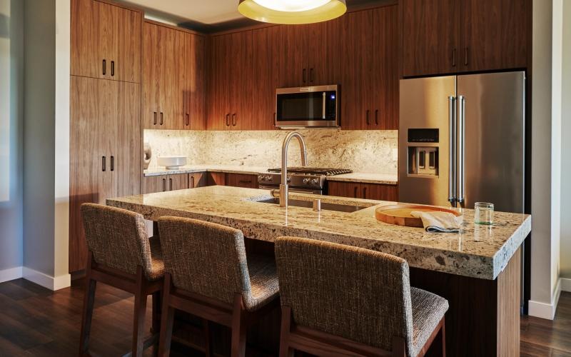 a kitchen with a marble island