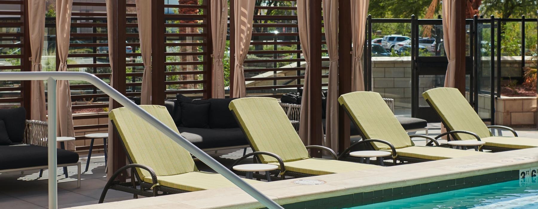 a pool with chairs around it