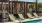 a pool with chairs around it