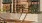 a building with a wood fence