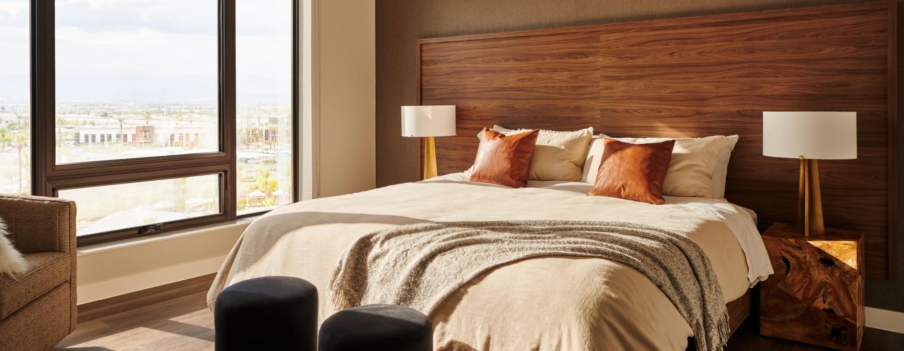 a bedroom with a large window